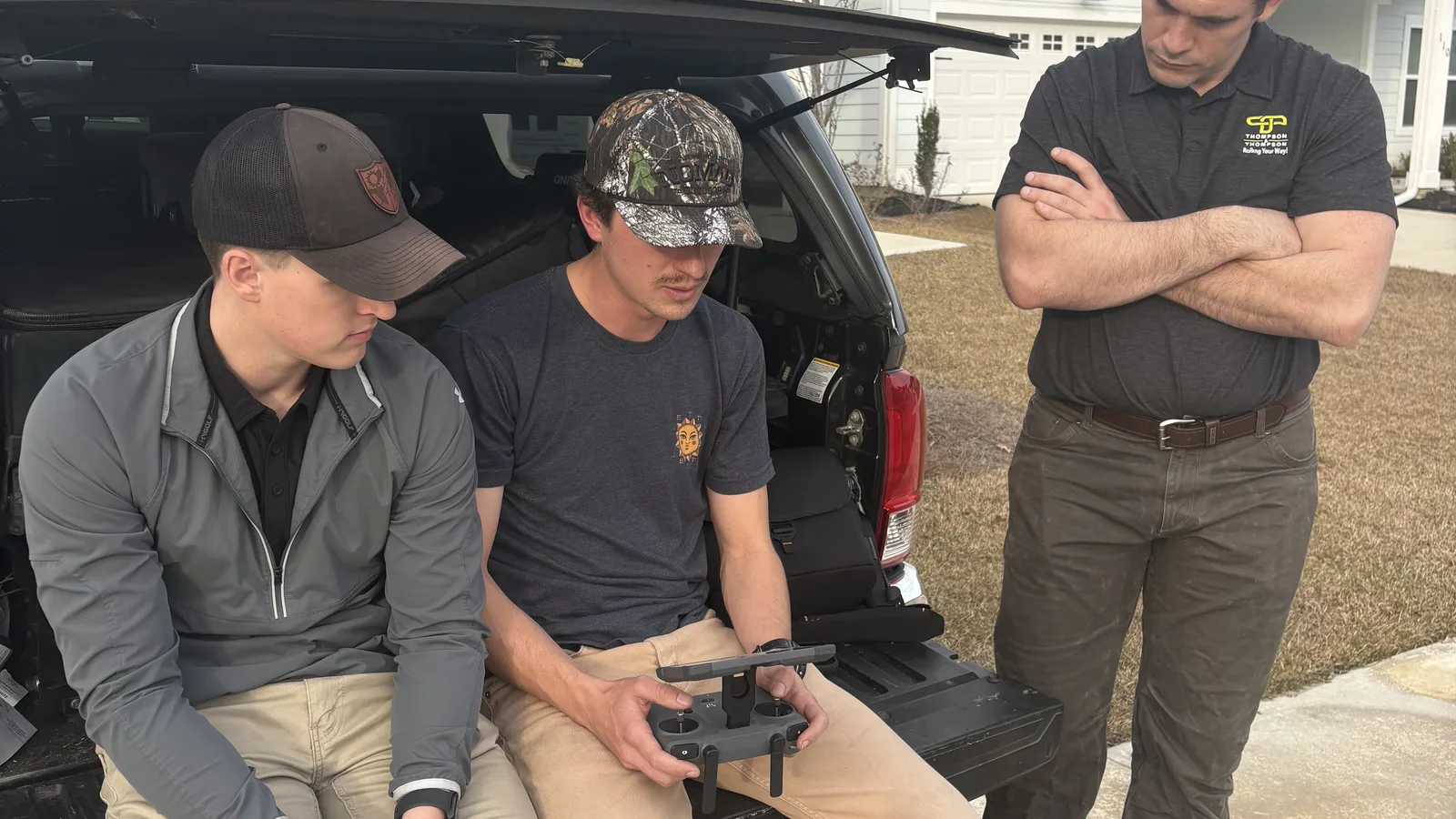 The High Tide Marketing team on-site flying a drone to capture video footage for a client project